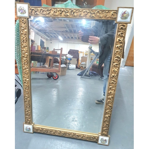 520 - Early 20thC ornate mirror with gesso frame with each corner containing an enamelled plaque depicting... 