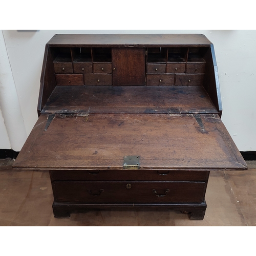 537 - Early Georgian Oak country writing bureau chest with drop-front revealing inner compartments above f... 