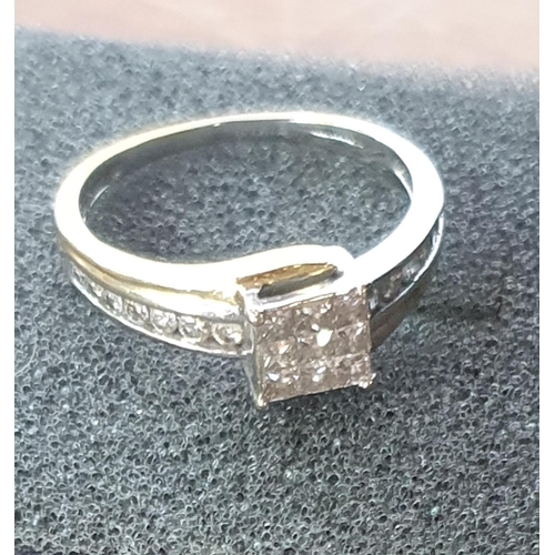 42 - 18K gold ring with central area of diamonds set in a square formation together with round cut diamon... 