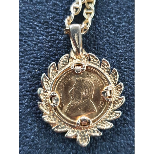 18 - 1982 1/10th oz Krugerand set in a hallmarked laurel wreath pendant on a 9ct gold flat linked chain s... 