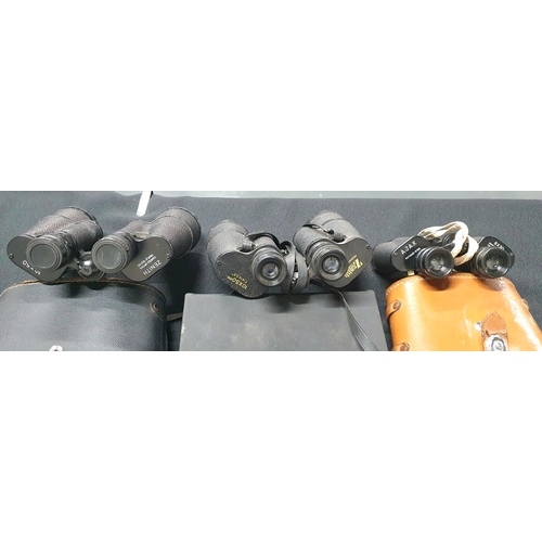 75 - Two cased sets of Zenith 10 x 50 Binoculars together with a cased set of Ajax binoculars (3)