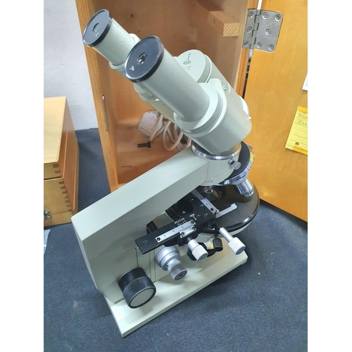 166 - Boxed Russian made LOMO BIOLAM MICROSCOPE together with a double ended case containing accessories.