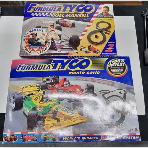 Two boxed Formula Tyco electric racing games 