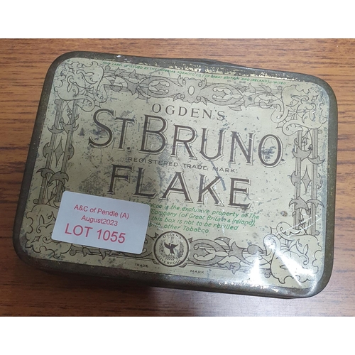 1055 - Old tin containing 1951 ration books and a clothing book and a WWII payment book and milk tokens etc