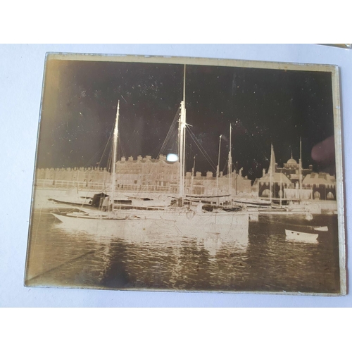 173 - Thirteen early 20thC glass photographic negatives depicting some continental town and harbour scenes... 