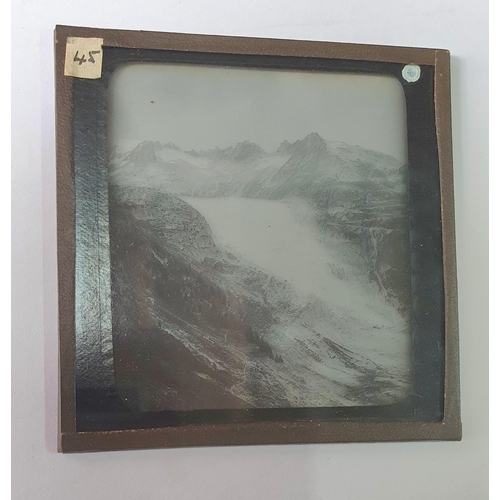 174 - Eight boxes of S.C.P lantern plates, the earliest stamped 1907 depicting Alpine scenes including cli... 