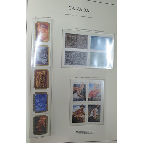 294 - Boxed red Canada album containing mint and used Canada sets and mini-sheets 1979-1992