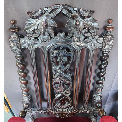 429 - Two Edwardian throne chairs, upholstered in red fabric with ornate carving and barley twist (2)