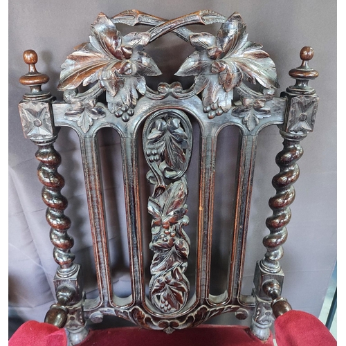 429 - Two Edwardian throne chairs, upholstered in red fabric with ornate carving and barley twist (2)