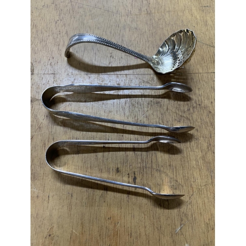 10 - Two old hallmarked silver sugar tongs with a silver sifting spoon (3)

74 grams