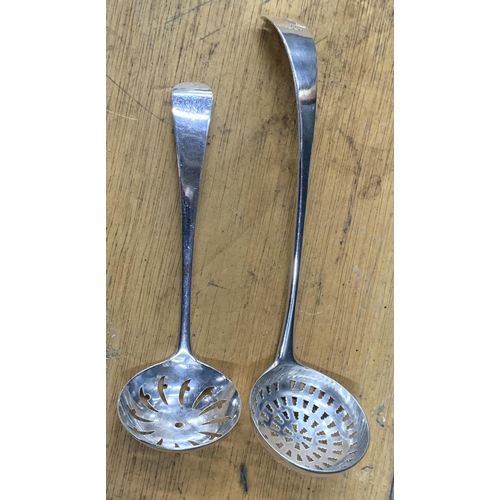 27 - 2 London Georgian (1796 and 1804) silver sugar shifter spoons (2),

58 grams