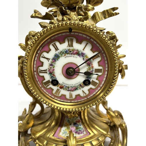 87 - 19thC gilt bronze ornate mantle clock with enamel face, retailed by  Aubert & Co, Regent Street, Lon... 