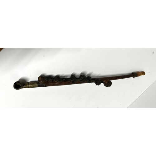 20 - Wooden carved antique Chinese Opium pipe

Approx 52cm long