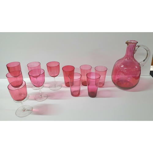 54 - Victorian cranberry jug with 6 associated wine glasses and 5 tumblers (12)