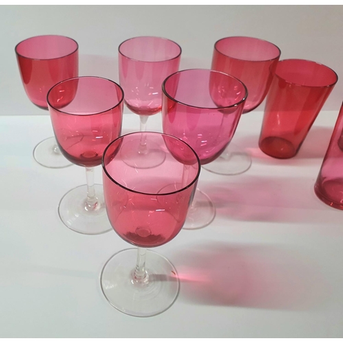 54 - Victorian cranberry jug with 6 associated wine glasses and 5 tumblers (12)