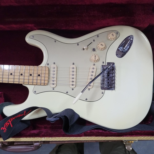 91 - Fender Stratocaster-style in Olympic white bearing serial No. Z200804 with hard case and accessories