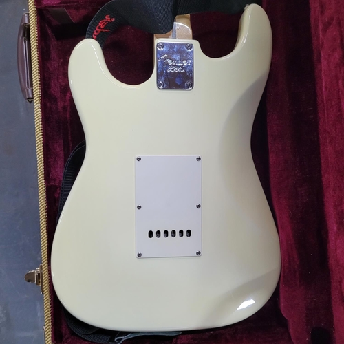 91 - Fender Stratocaster-style in Olympic white bearing serial No. Z200804 with hard case and accessories