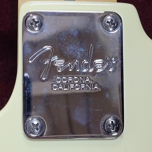 91 - Fender Stratocaster-style in Olympic white bearing serial No. Z200804 with hard case and accessories