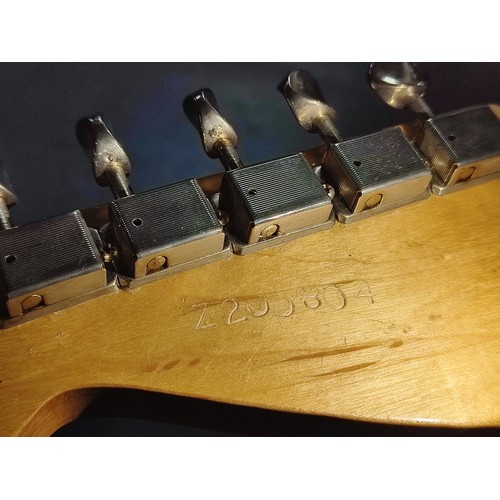 91 - Fender Stratocaster-style in Olympic white bearing serial No. Z200804 with hard case and accessories