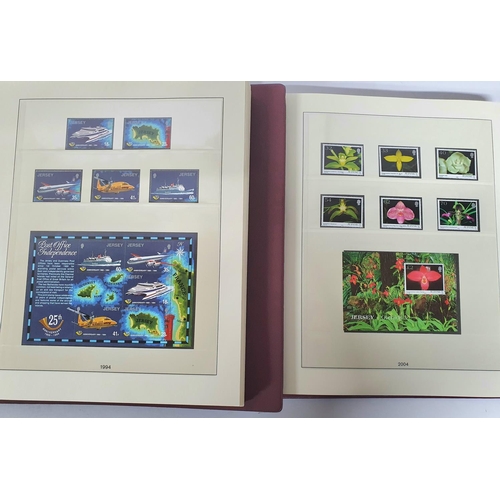 223 - Two red box albums both containing mint unmounted complete Jersey 1991 to 2009 - approx £675 face va... 