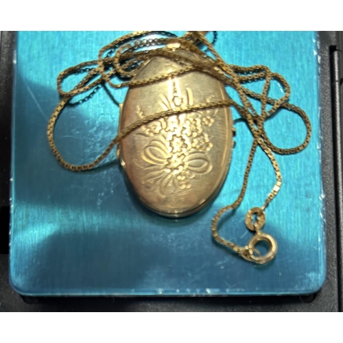 12 - 9ct yellow gold chain and large oval locket,

9.6 grams