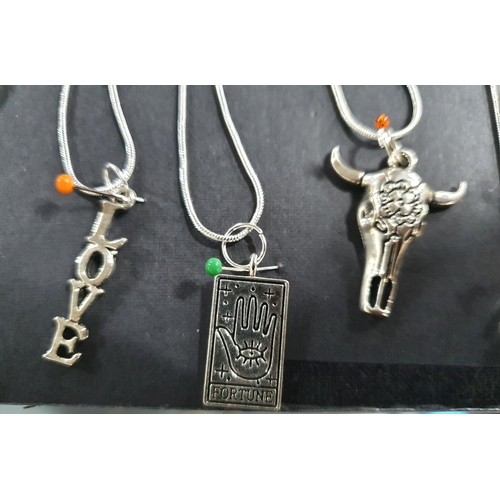 21 - Six silver chains together with a quantity of Asian silver pendants (Qty)