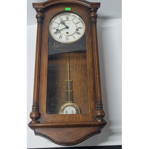 173 - Hanging wood cased wall clock