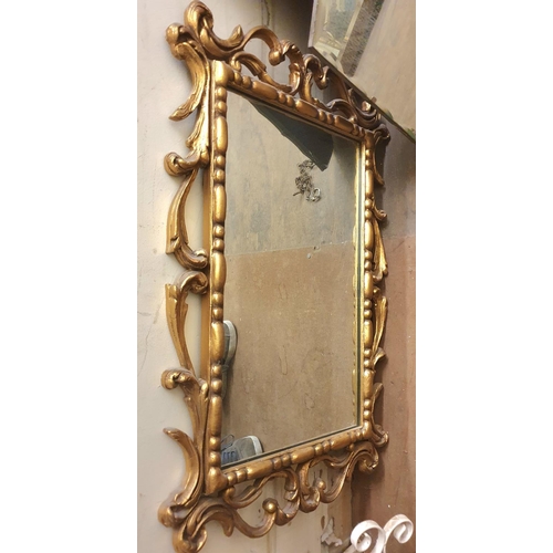 123 - A frameless Edwardian mirror together with 3 ornately framed later mirrors (4)