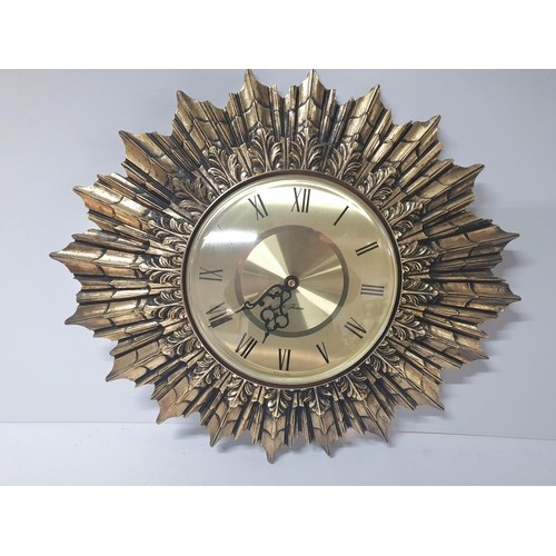 139 - Thomas of Scotland 20thC star burst style wall battery wall clock