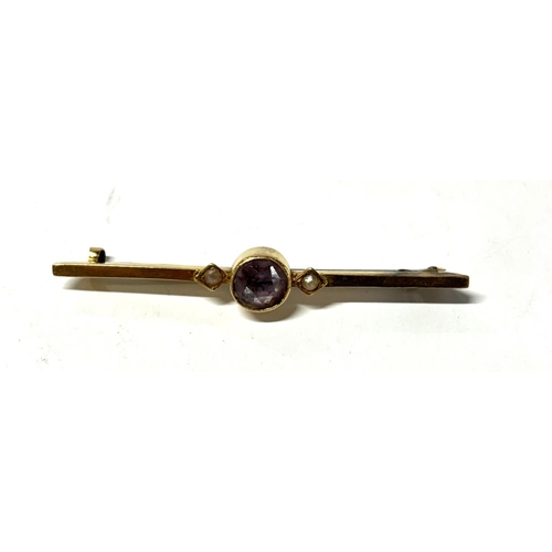 30 - Antique 15ct yellow gold bar brooch with central circular amethyst flanked by a seed pearl to either... 