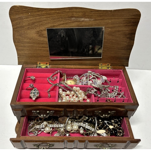 50 - Costume jewellery box containing costume including Rings and Watches