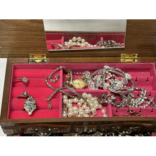 50 - Costume jewellery box containing costume including Rings and Watches