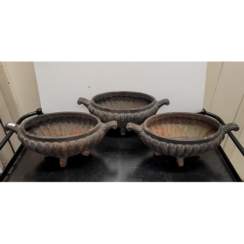 69 - Three small old cast-iron planters (3)