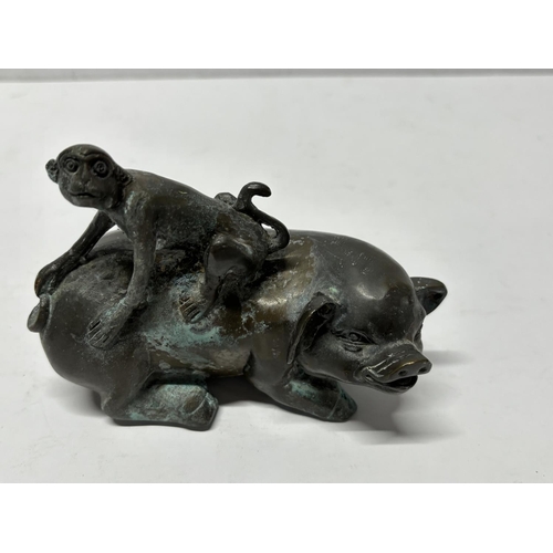 81 - Bronze Chinese Pig with Monkey on back, signed in Chinese