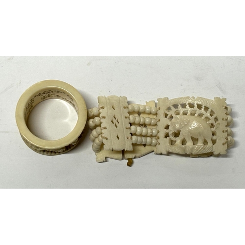 154 - Carved Bone napkin ring with bracelet