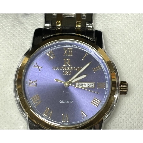 171 - ONTHEEDGE blue faced watch with papers and boxed