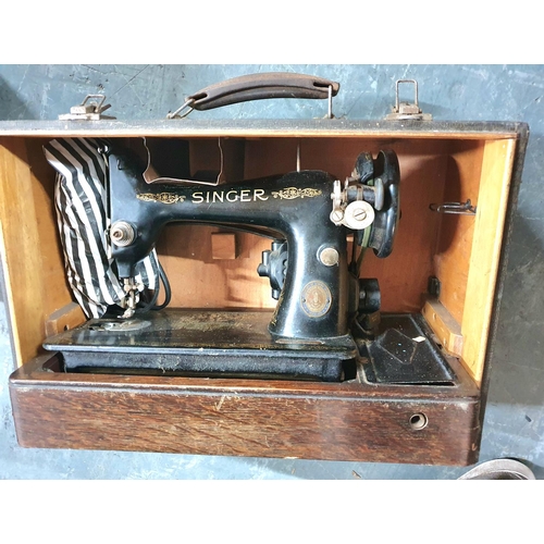 213 - Old electric Singer sewing machine in its old carry 