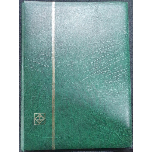 270 - Green stock album, mainly empty but containing GB KGV used