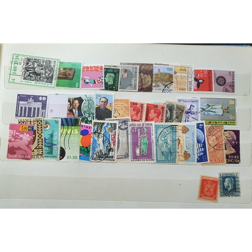 272 - Blue stamp album containing a large collection of mint and used world 20thC stamps (Qty)