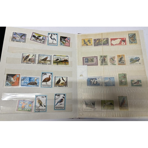 279 - Blue Stamp Album containing world stamps, mainly used unmounted including a large quantity of bird r... 