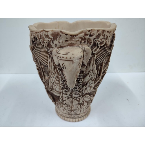 403 - Heavily carved oriental vase with landscape and figures depicted with the handles in the form of ele... 