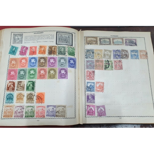 280 - Four stamp albums, the largest (red), half filled with 20thC Hungary, one other with Germany 20thC u... 