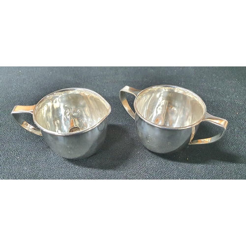 15 - Sterling silver cream jug & sugar basin in plain form with single 