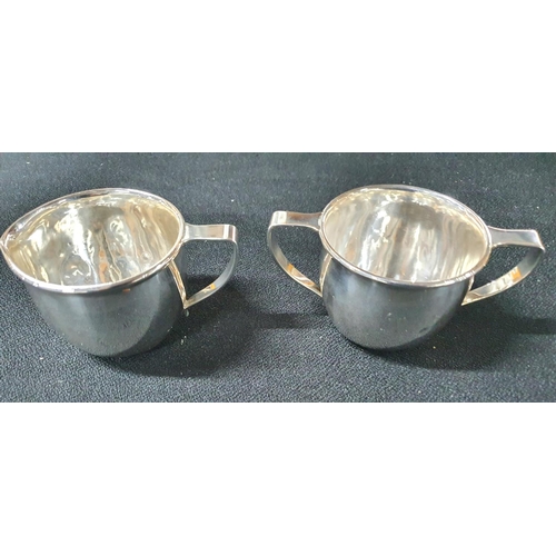 15 - Sterling silver cream jug & sugar basin in plain form with single 