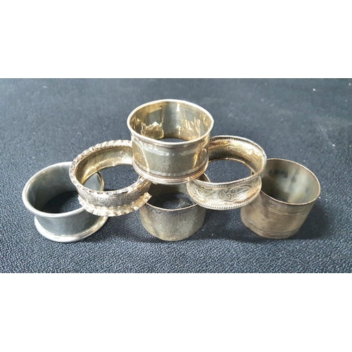 16 - Five silver napkin rings together with a pewter example (6)