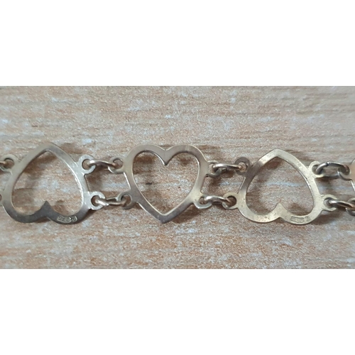 21 - 9ct yellow gold love heart bracelet,

19 cm long                    3 grams