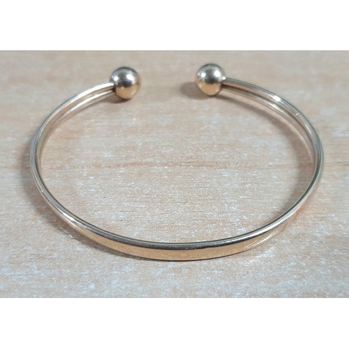 23 - 9ct Birmingham hallmarked yellow gold torque bangle

4.9 grams