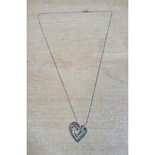 25 - 9ct white gold and diamond heart pendant on a 9ct white gold chain,

2.9 grams gross           46cm ... 