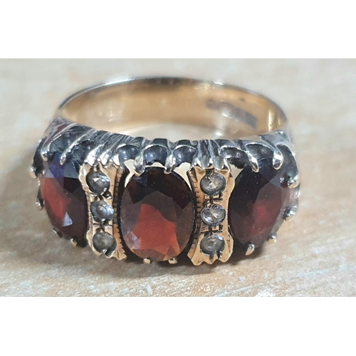 33 - 9ct yellow gold and 3 large Garnets with 3 small round cut diamonds set between the Garnets ring,

3... 