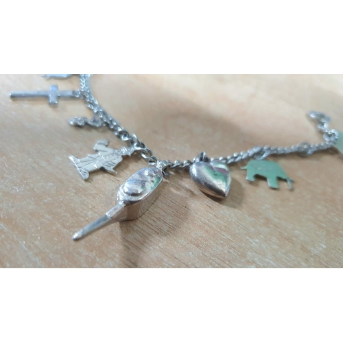 37 - Silver charm bracelet with T-bar fastener,

14 grams              17cm long